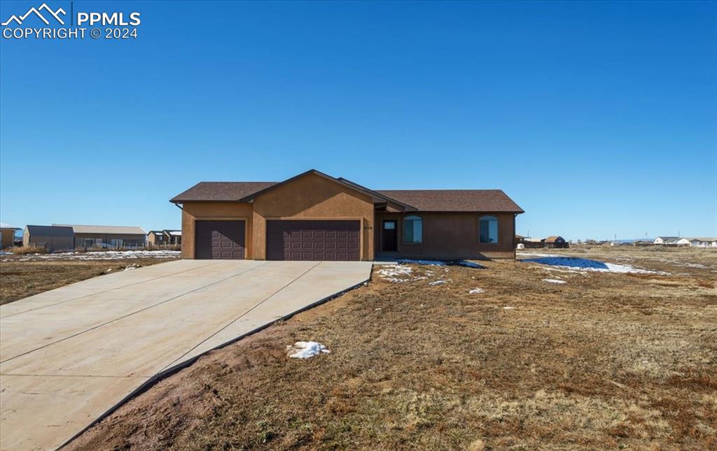 Single story home with a garage