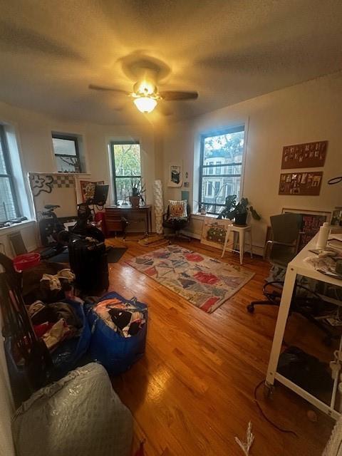 a living room with furniture window and wooden floor