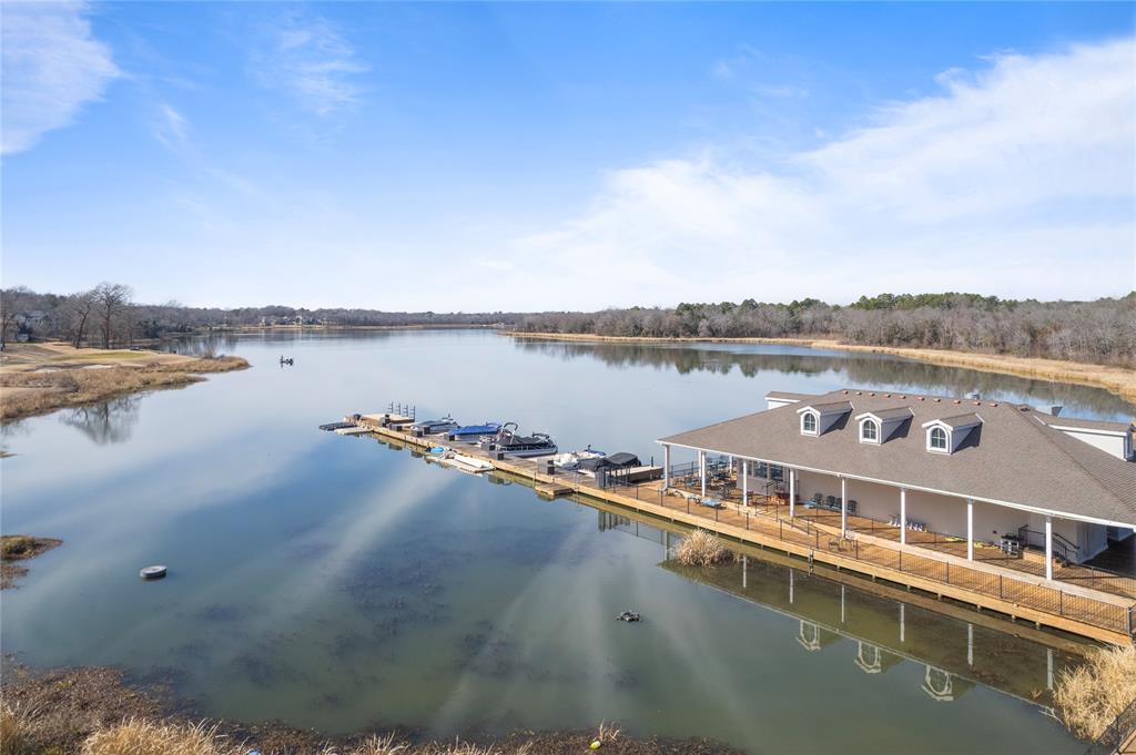 a view of a lake with houses in the back