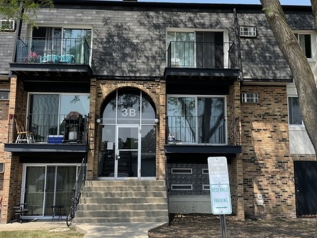 a front view of a house with glass windows