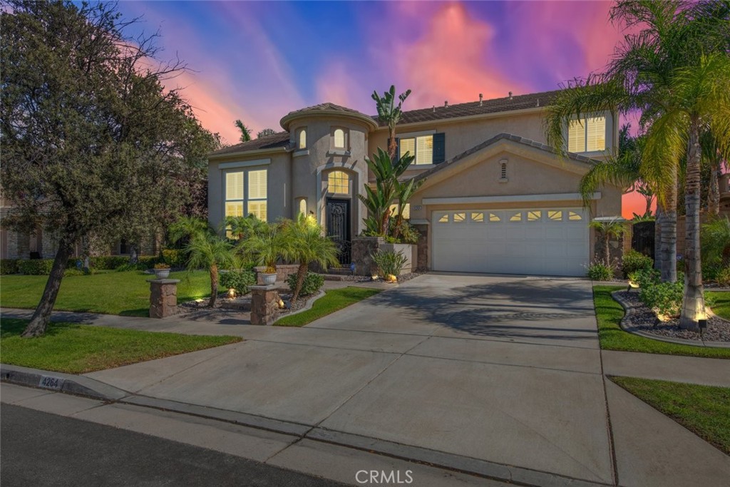 Located in a prestigious neighborhood, this stunning home features an elegant architecture and lush landscaping.