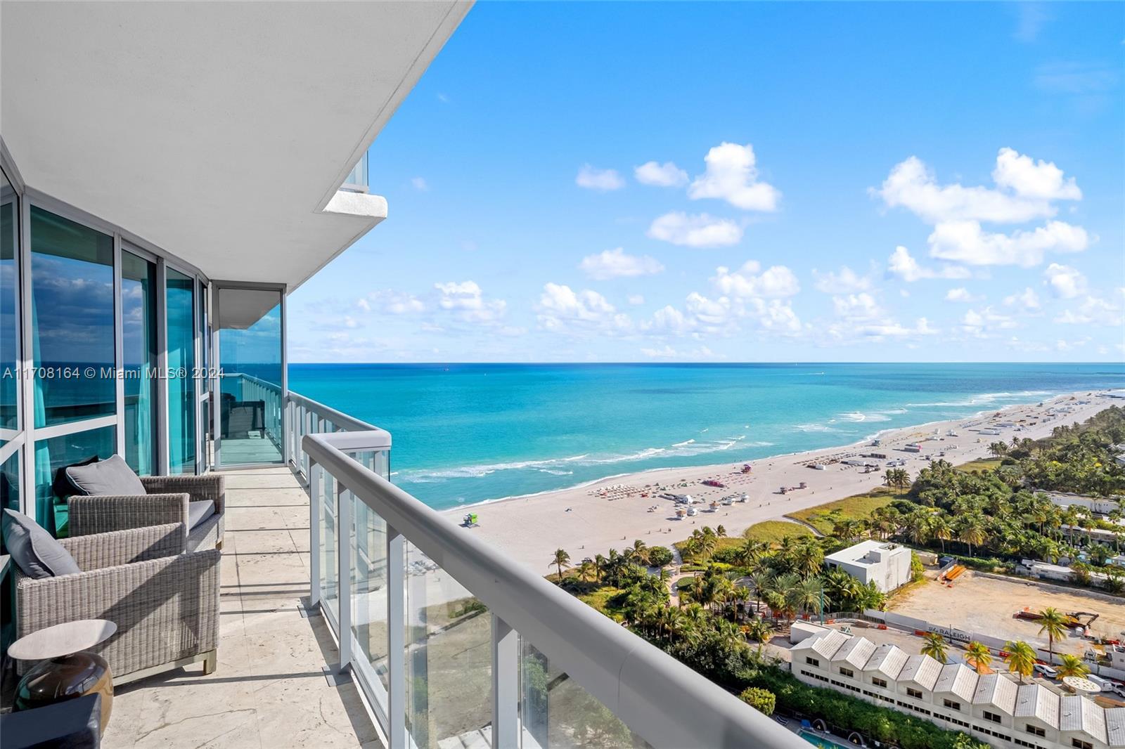 a view of a balcony with an ocean view