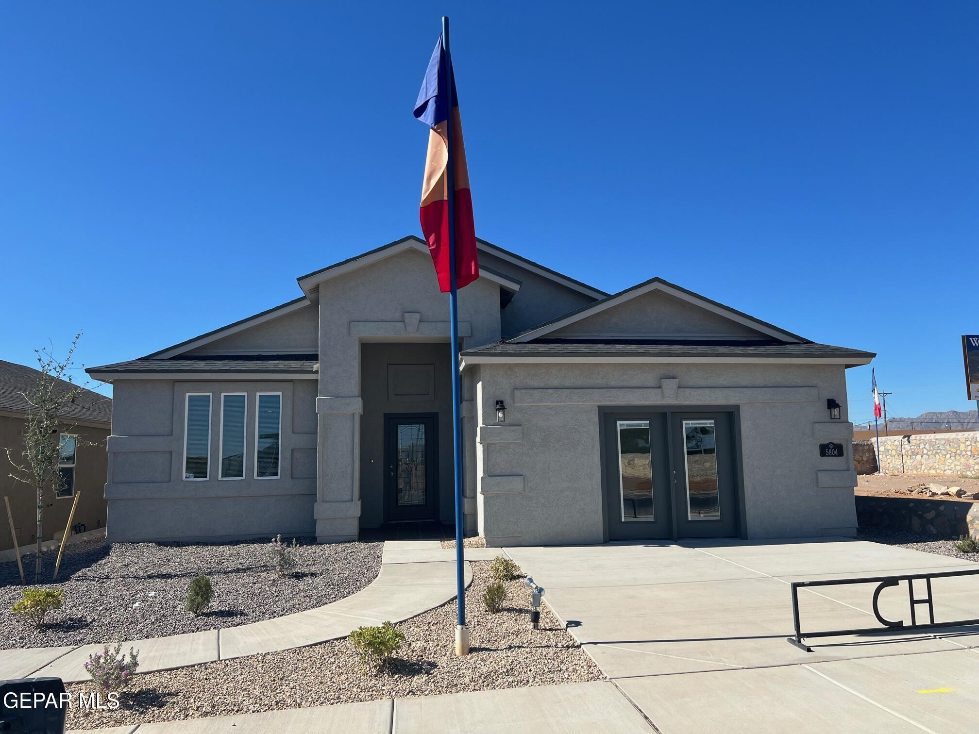 a front view of a house with garage