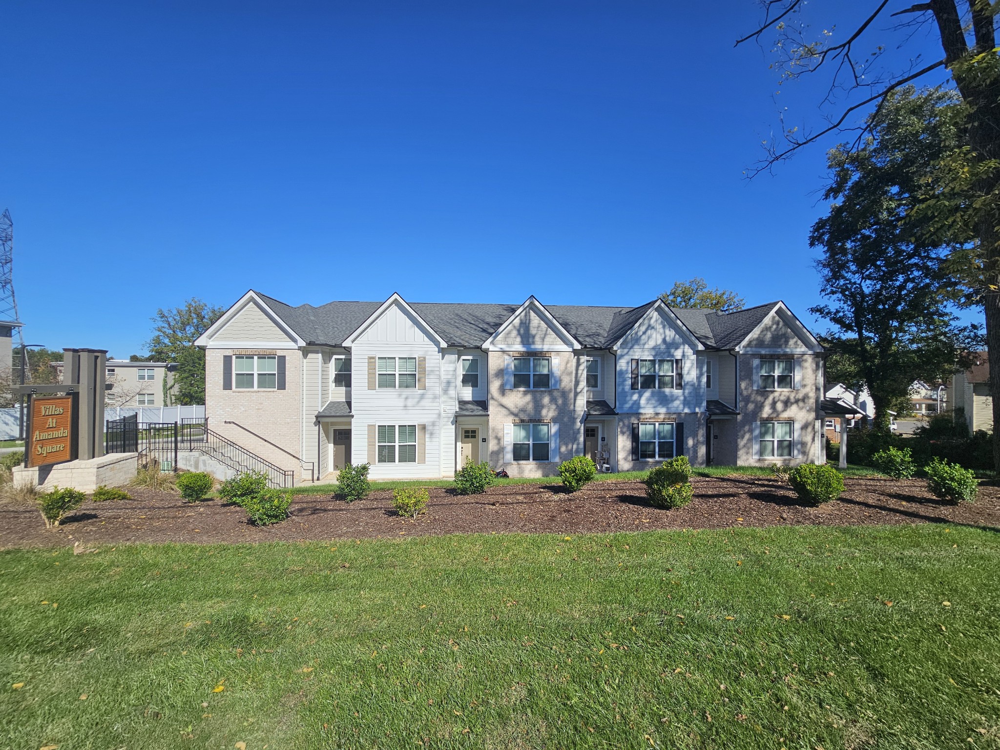 a view of house with yard and green space