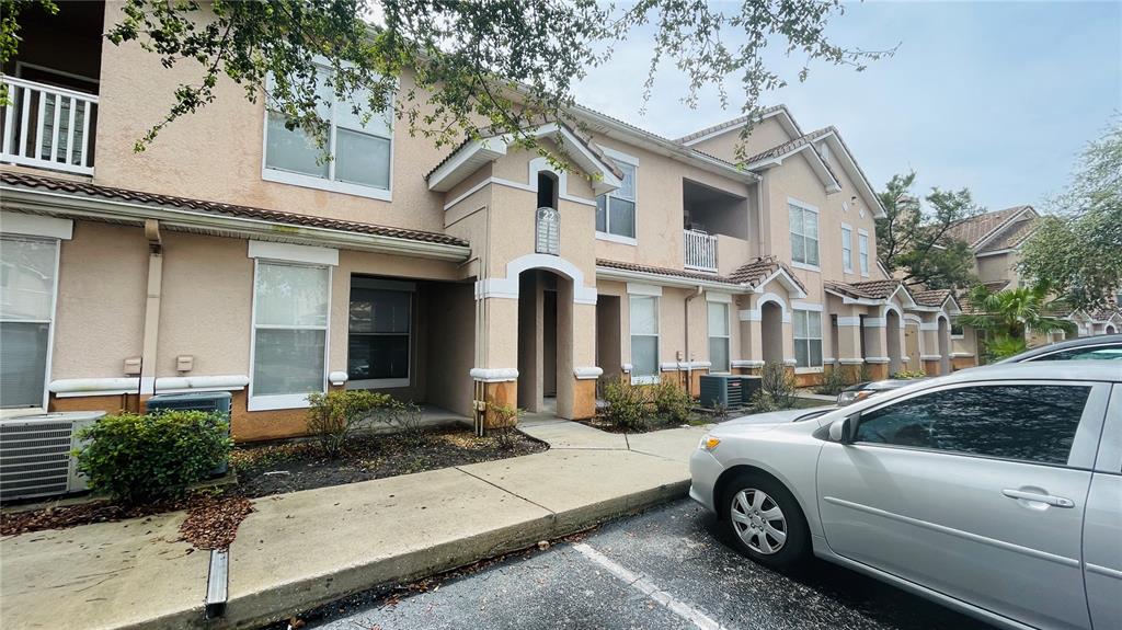 a front view of a house with parking space