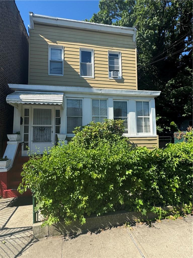 View of front of property featuring cooling unit