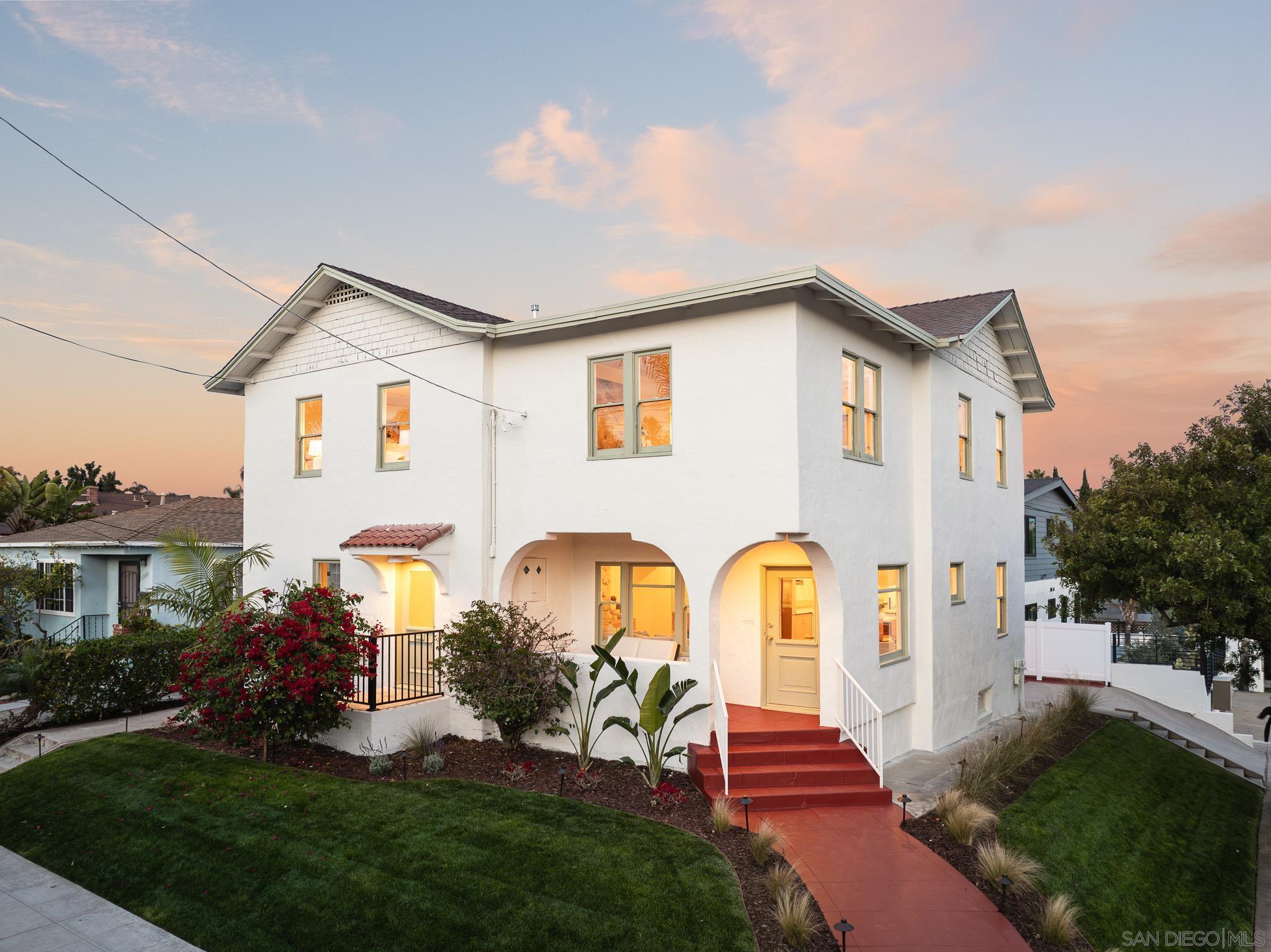 a front view of house with yard and green space