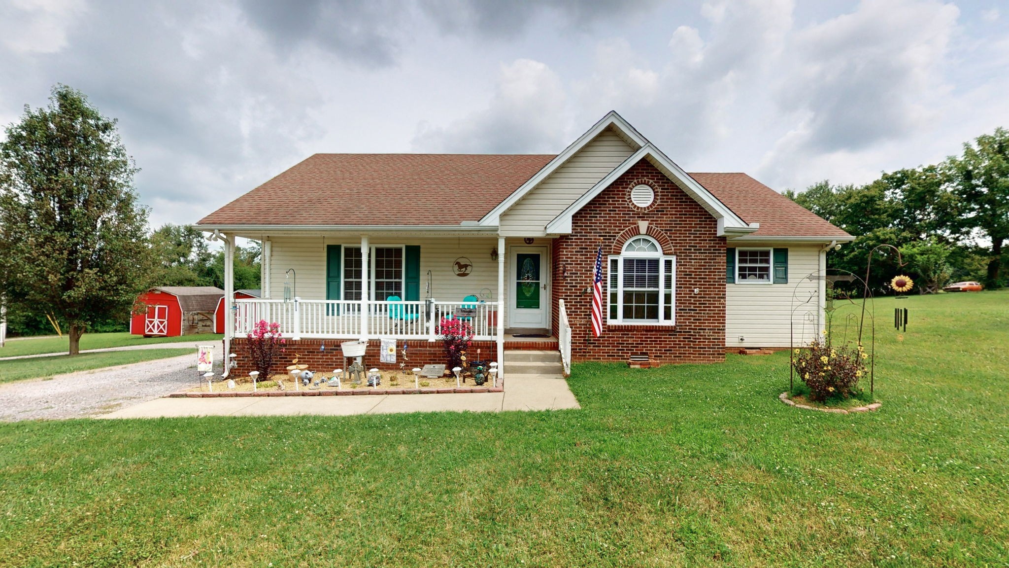 a front view of house with yard and outdoor seating