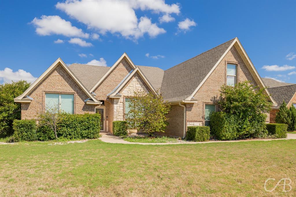 a front view of a house with yard