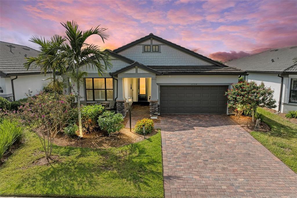 a front view of a house with garden