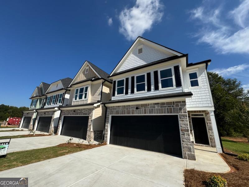 a front view of a house with a garage