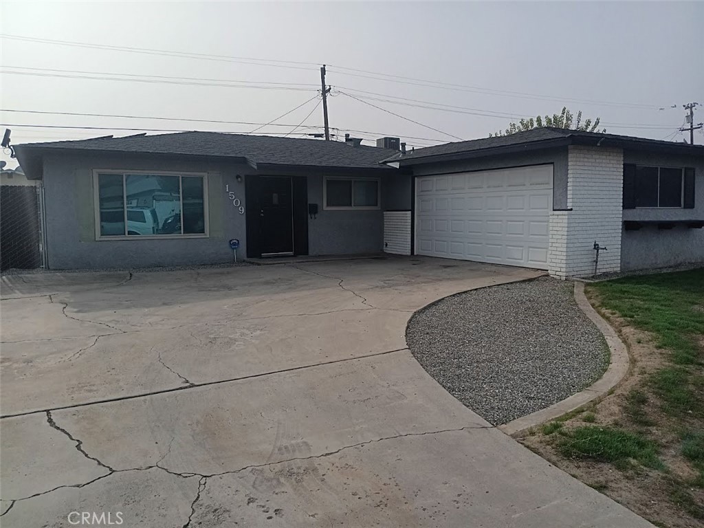 a front view of a house with garage