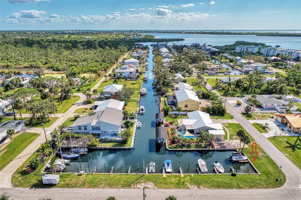 OVERHEAD VIEW OF THE BOAT DOCK BASIN.  NOTE RED ARROW TO THE RIGHT.  THIS IS THE DOCK FOR SALE.  B82.  SOLD WITH LOT 8225 ROBERT ST.  THESE TWO PARCELS CAN BE SOLD SEPERATELY.  $75000 EACH.  