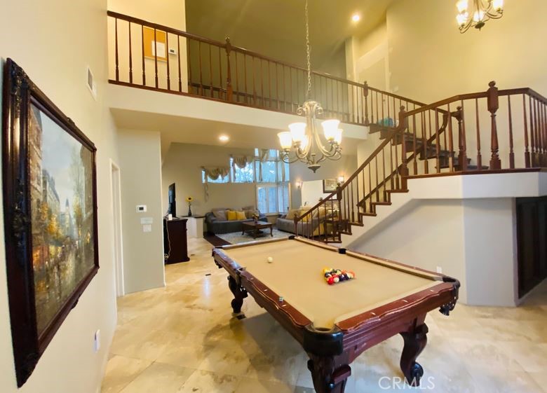 a room with table soccer and stairs