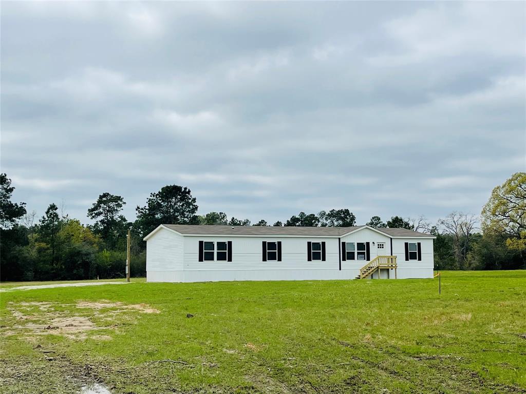 a view of a yard in front of a house with a yard