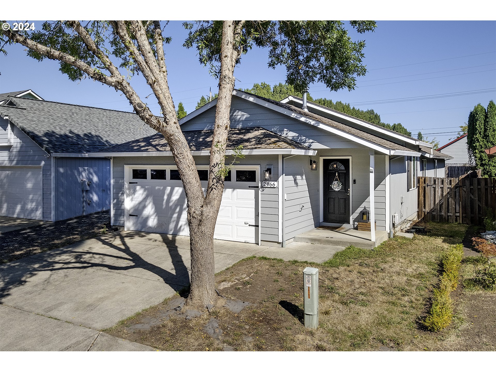 a house with trees in the background