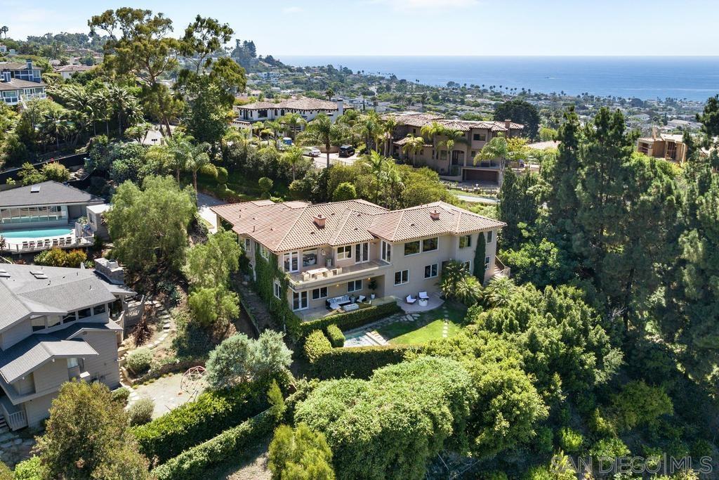 an aerial view of a house with a garden