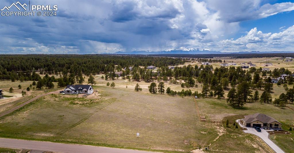 Birds eye view of property with a rural view