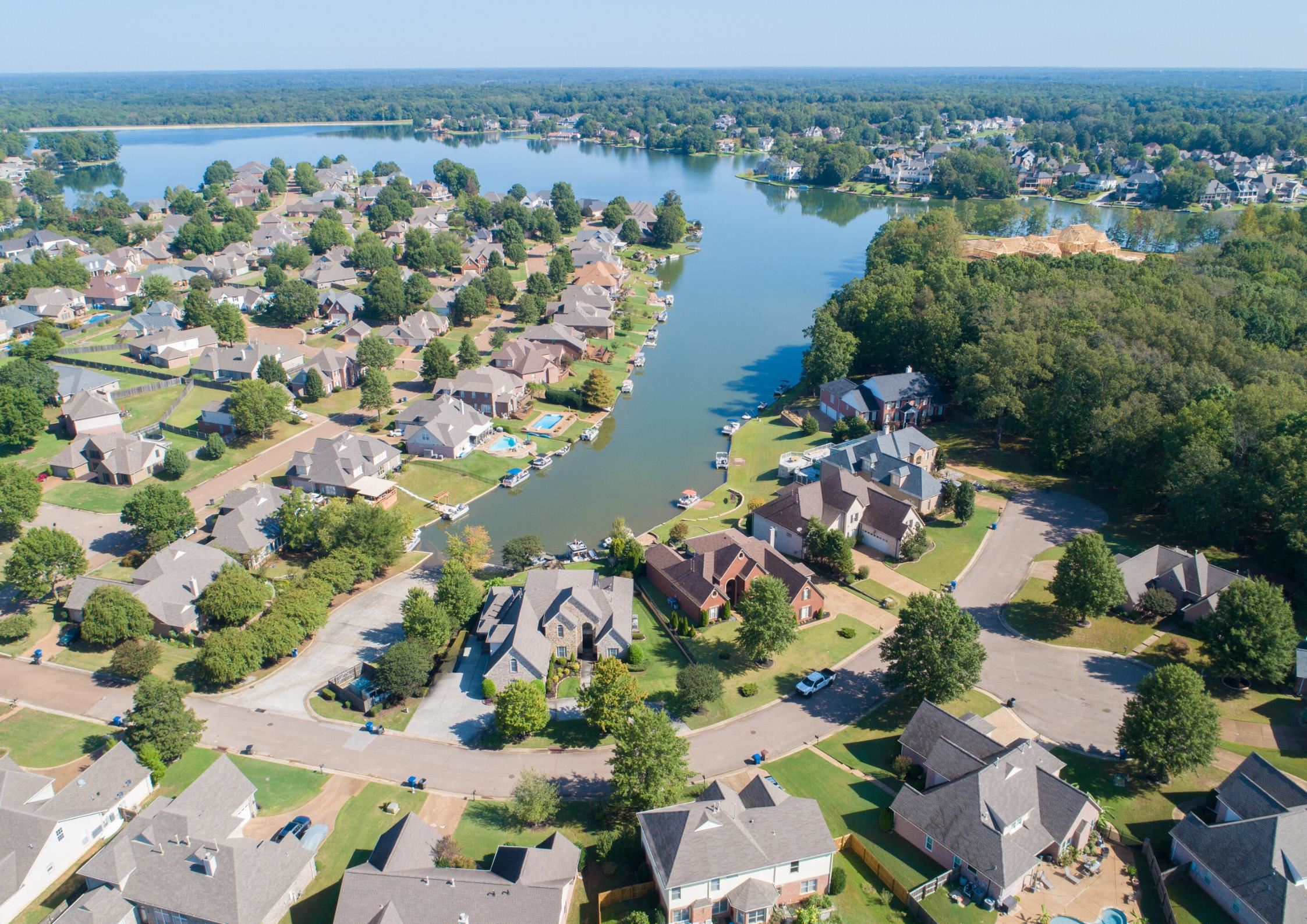 From above, the drone captures this stunning home on the lake, complete with a private boat dock. It’s a picturesque retreat, perfectly positioned for lakefront living and relaxation.