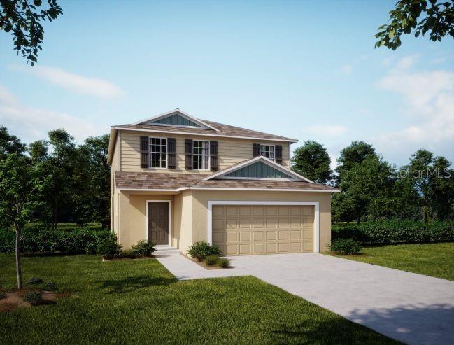 a front view of a house with a garden and yard