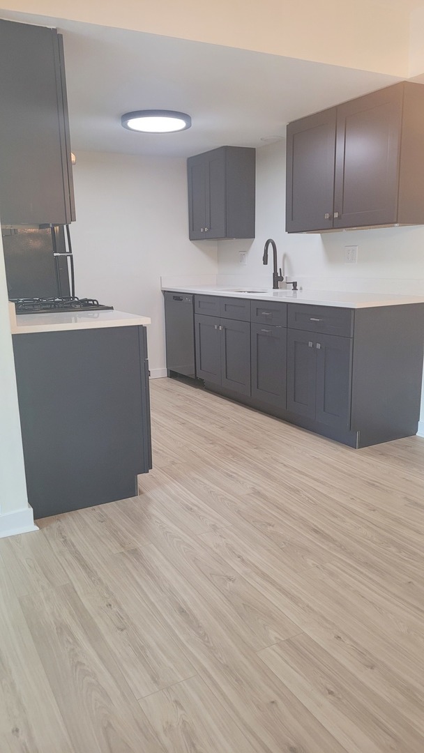 a room with a cabinets and wooden floor