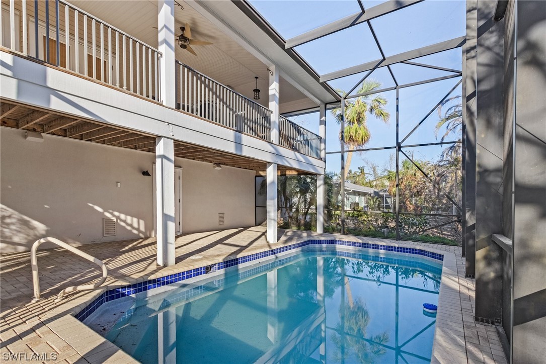 a view of a balcony with a sink and wooden floor