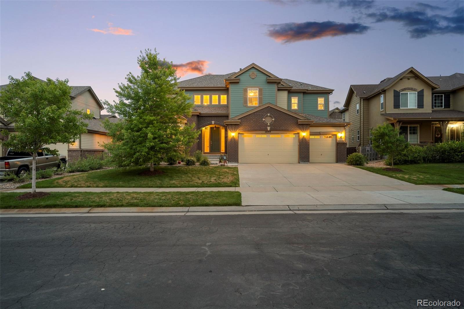 a front view of a house with a yard