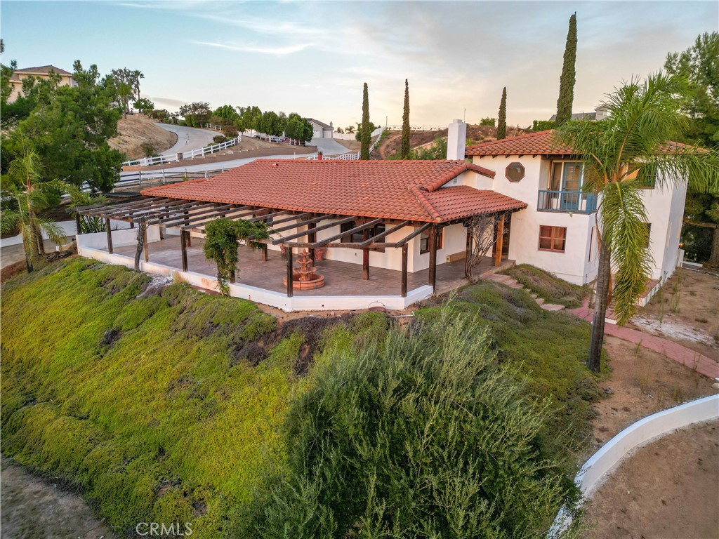 a aerial view of a house with table and chairs