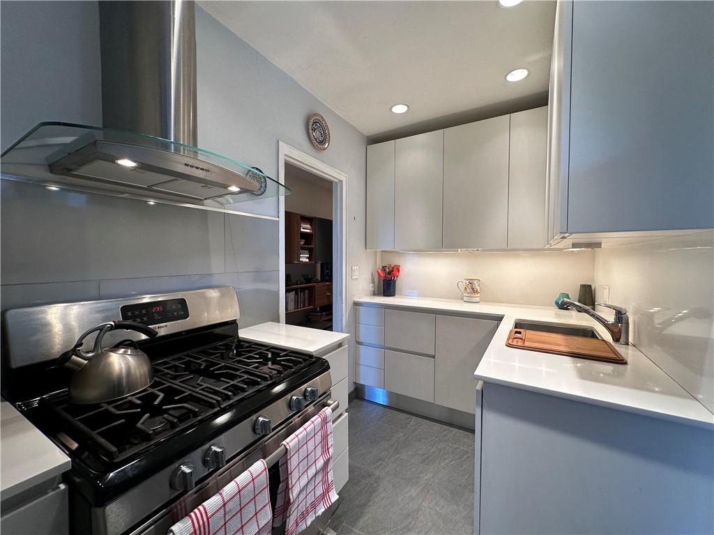 a kitchen with a stove and a refrigerator