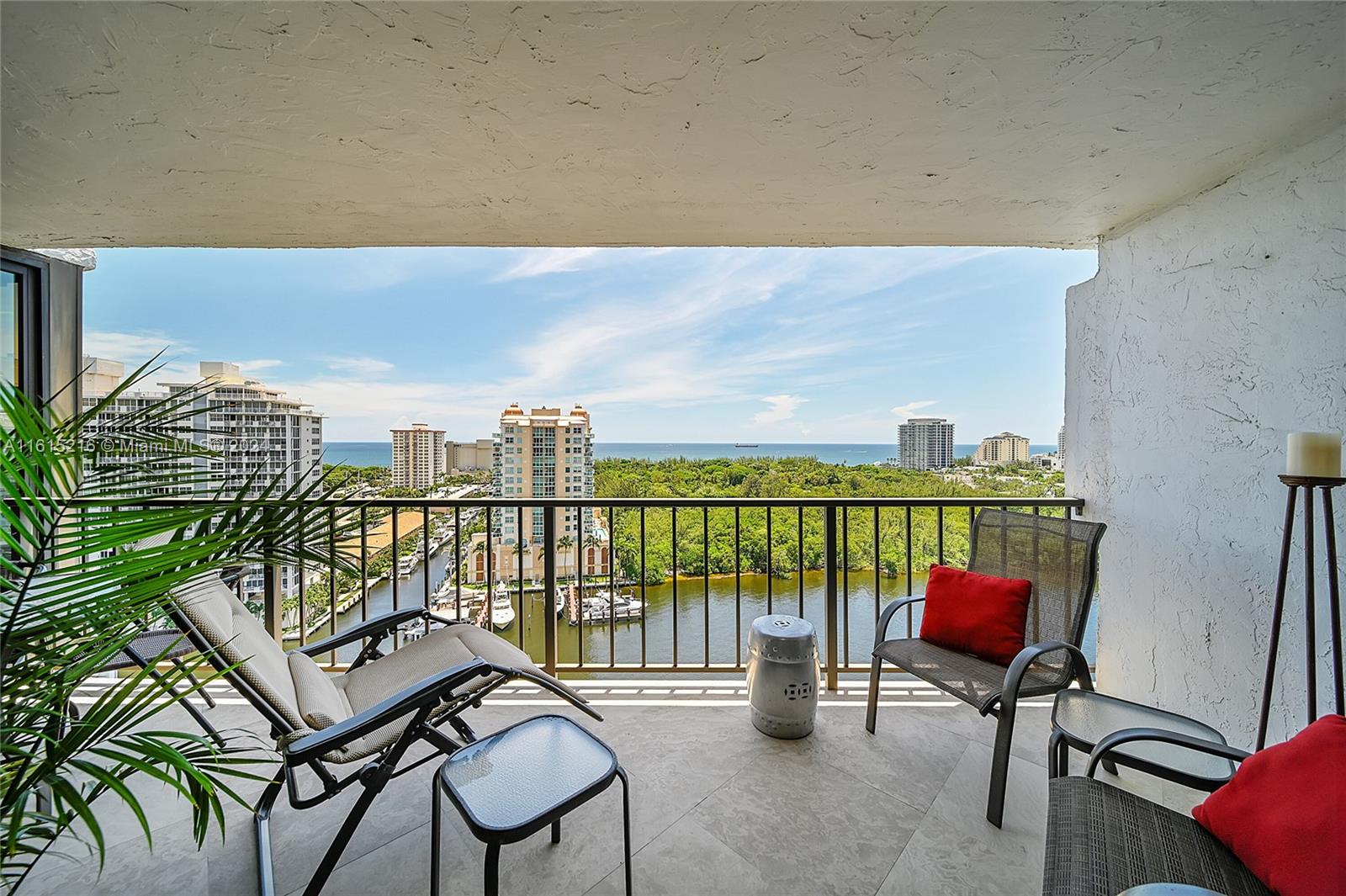 a balcony with a couch and chairs