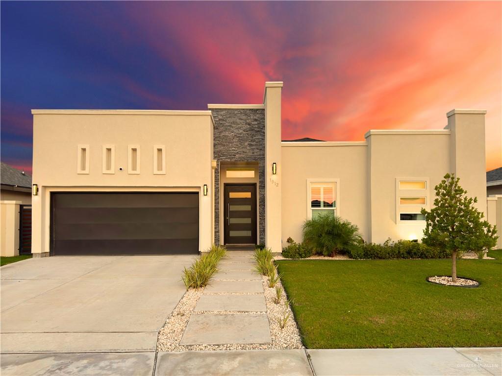 View of front facade with a lawn