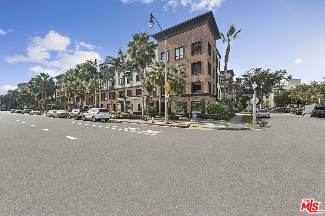 a view of a street with a building in the background