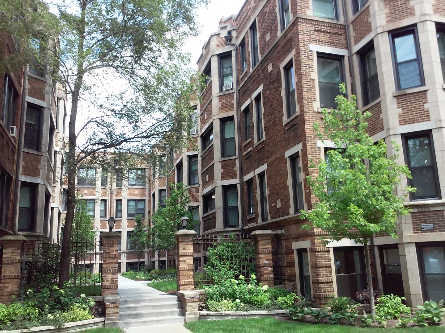 a view of buildings with brick walls