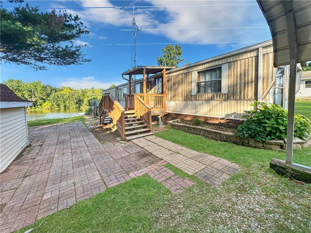 a view of a small yard with wooden fence