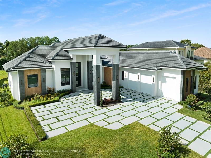 a view of a house with a backyard and porch