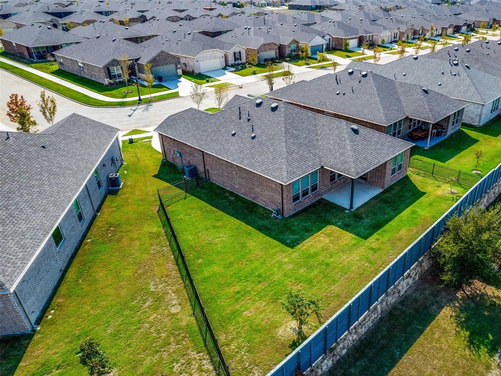 an aerial view of a house with a swimming pool