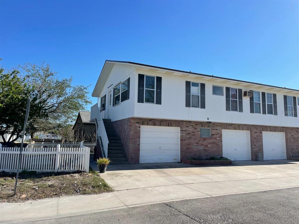 a front view of a house with a garage