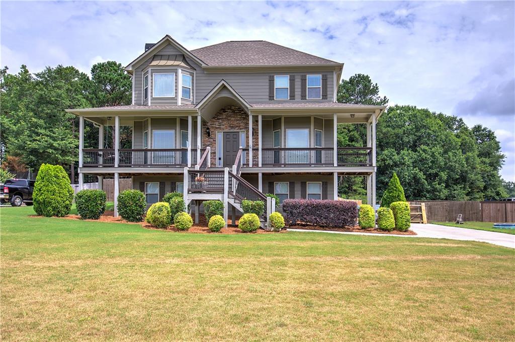 a front view of a house with garden