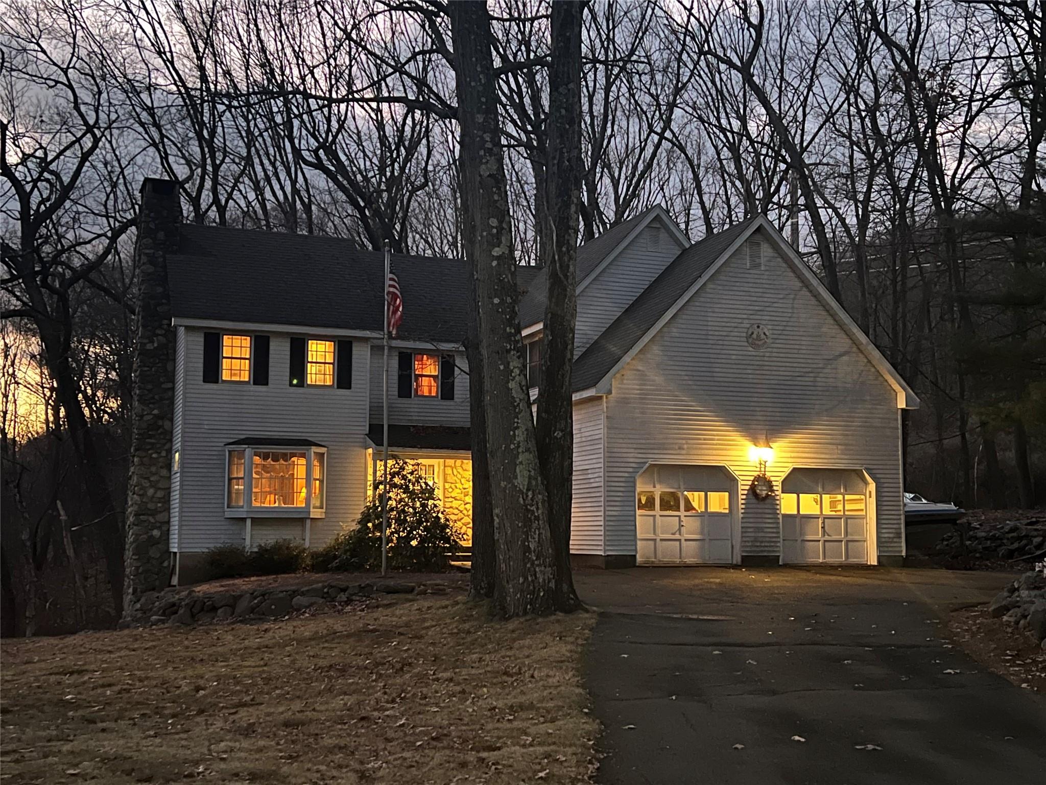 a view of a house with a yard