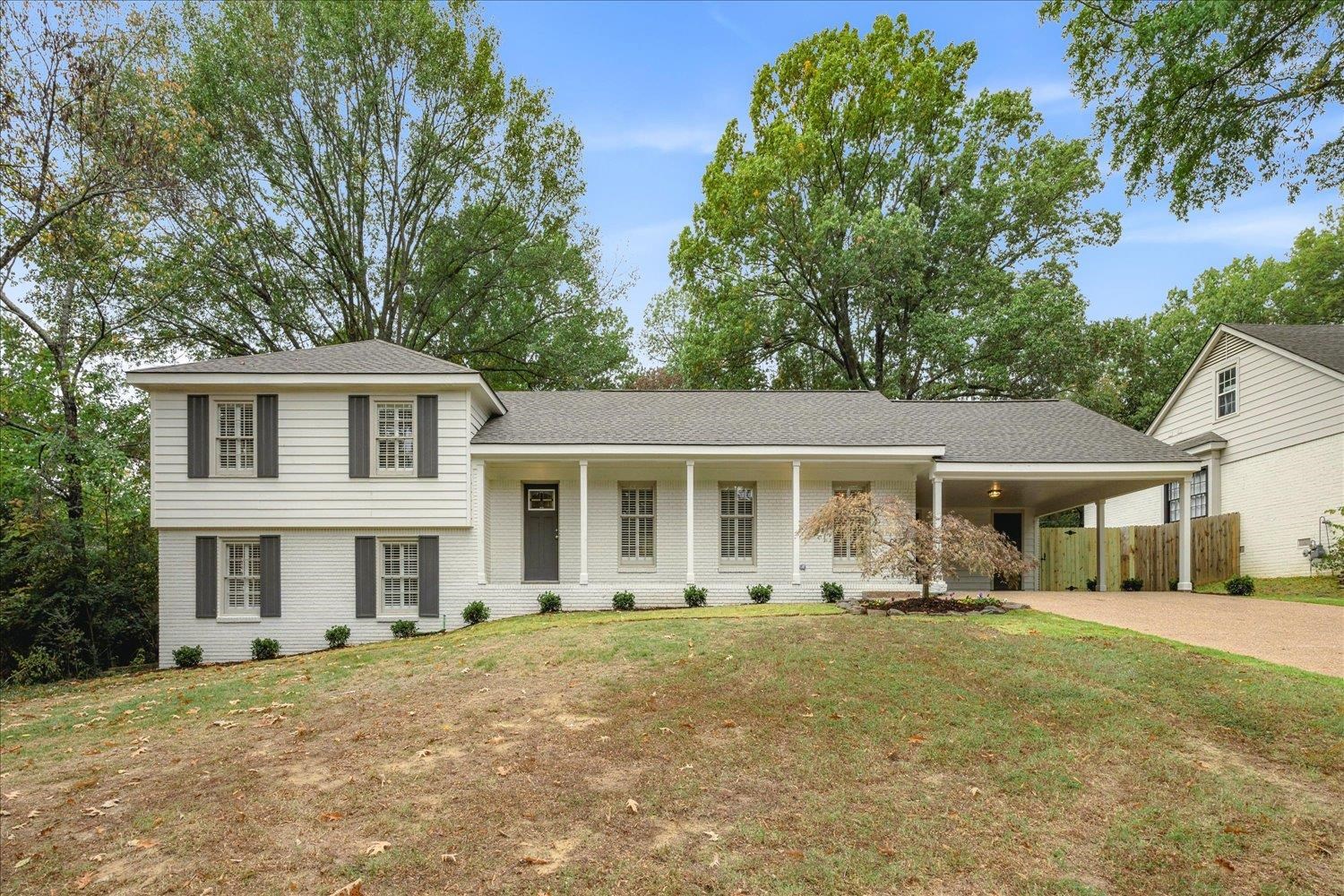 a front view of a house with a yard