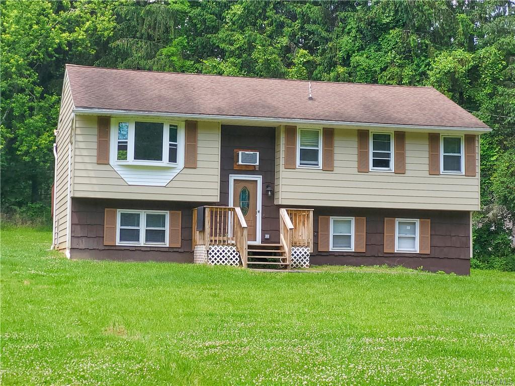 Bi-level home with a front yard