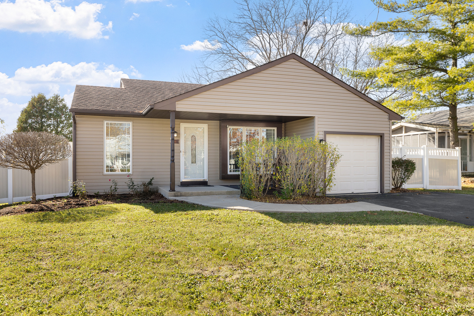 a front view of a house with a yard