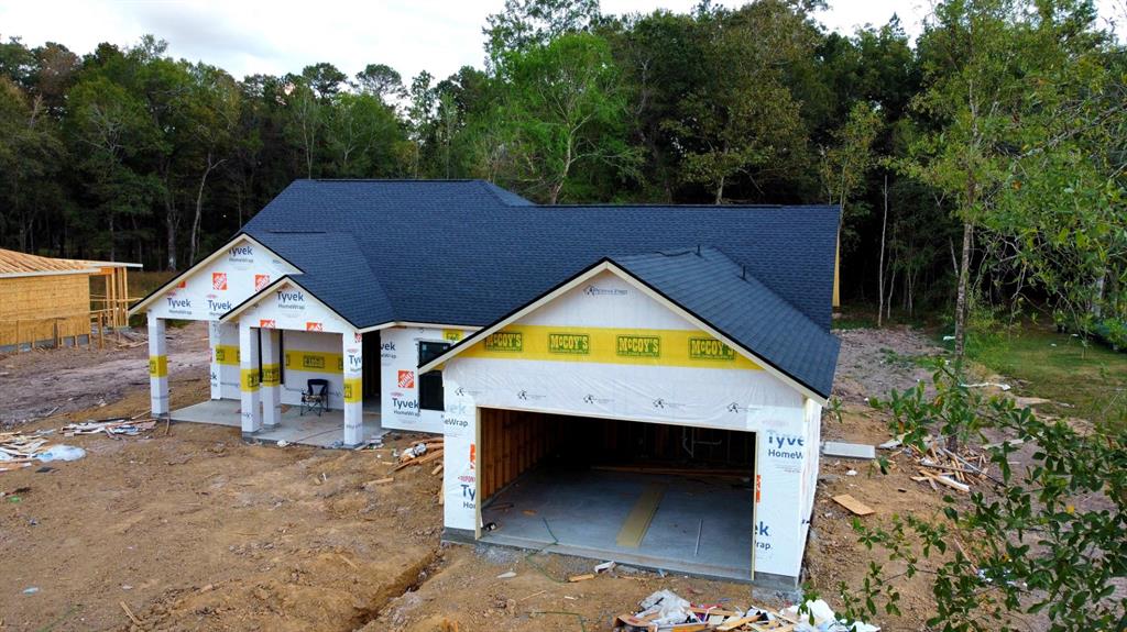 a view of house with pool and yard