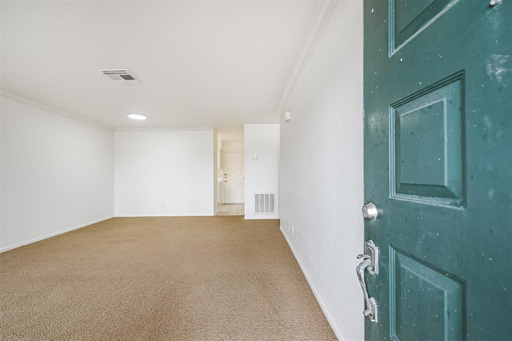 a view of a big room with closet and mirror