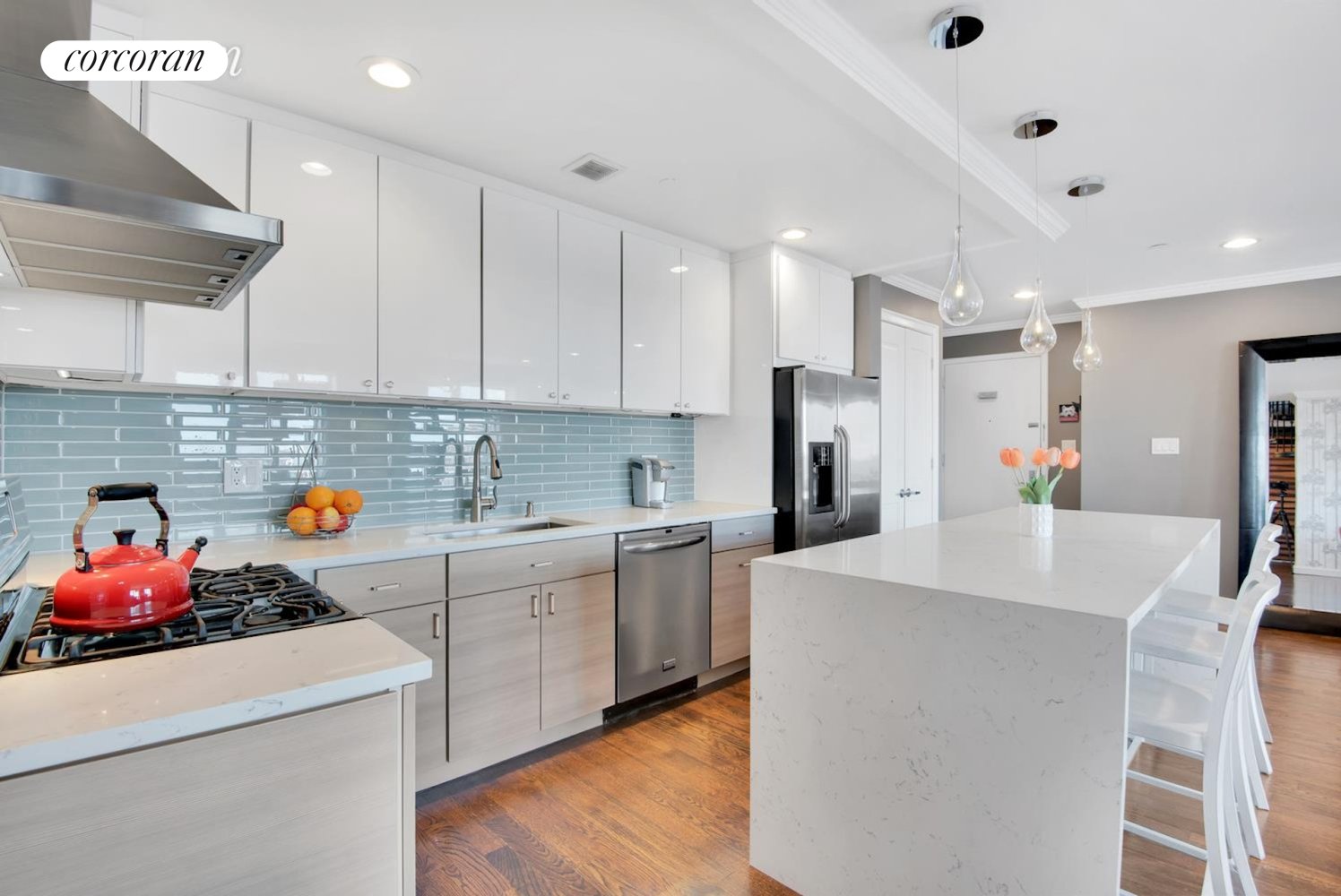 a kitchen with a sink white cabinets and white appliances