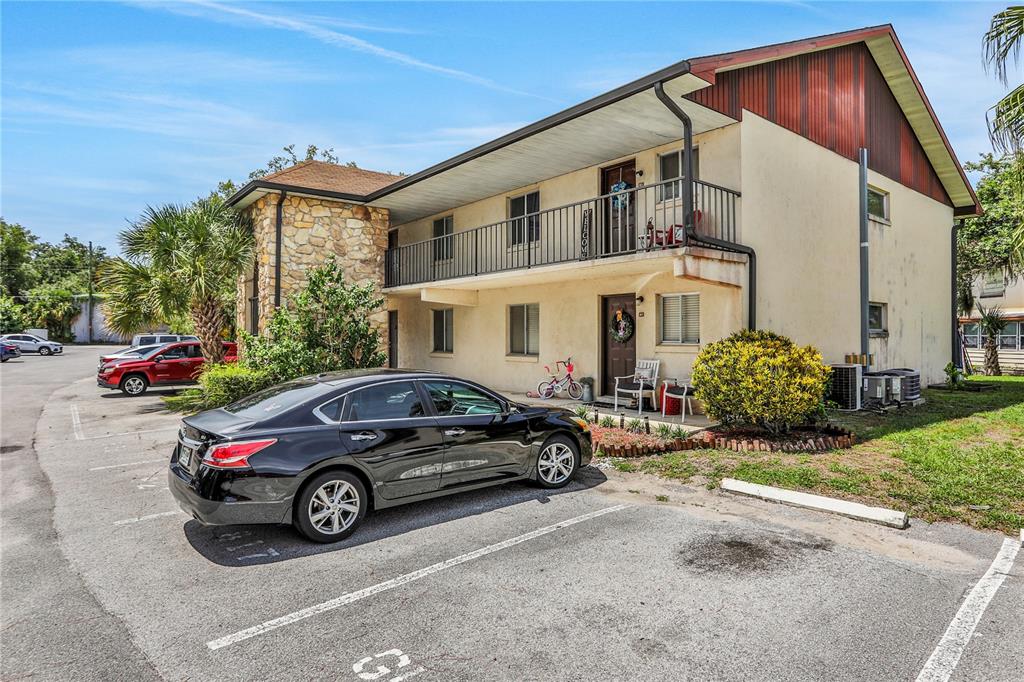 a view of a car parked in front of a house