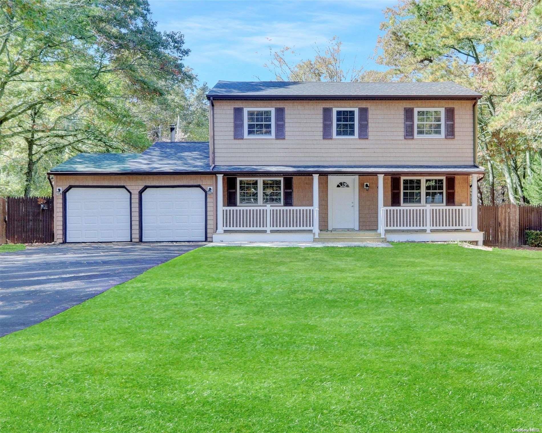 a house that has a big yard in front of it