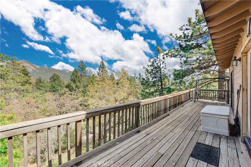 a view of a balcony with wooden floor