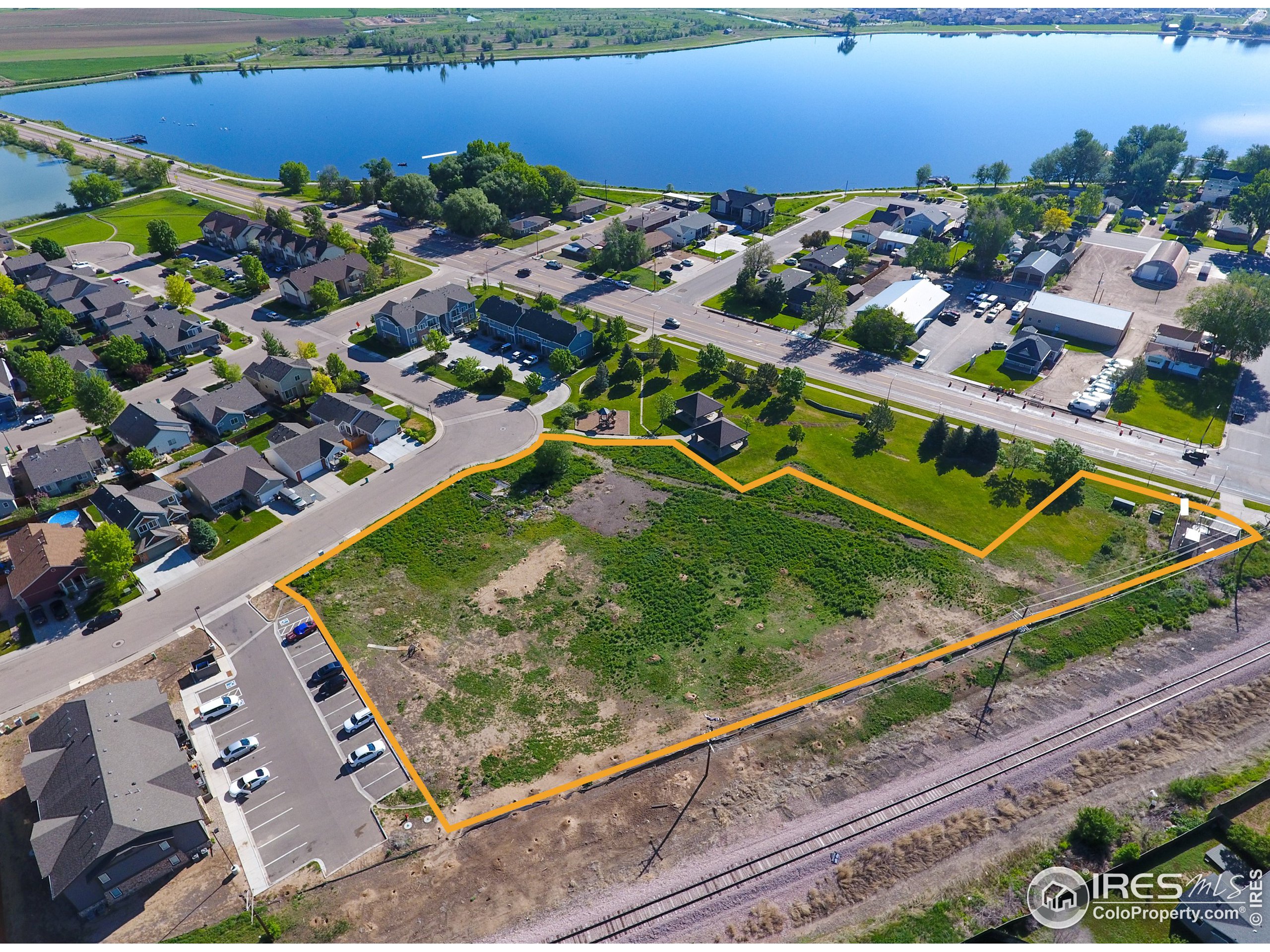 an aerial view of a residential houses with outdoor space