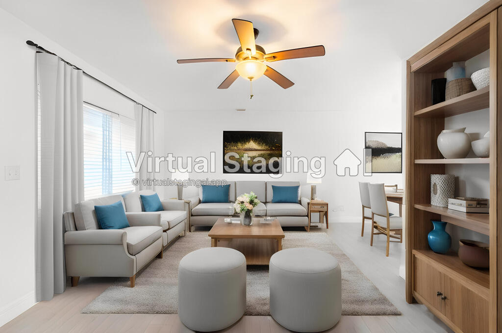 a living room with fireplace furniture and a window